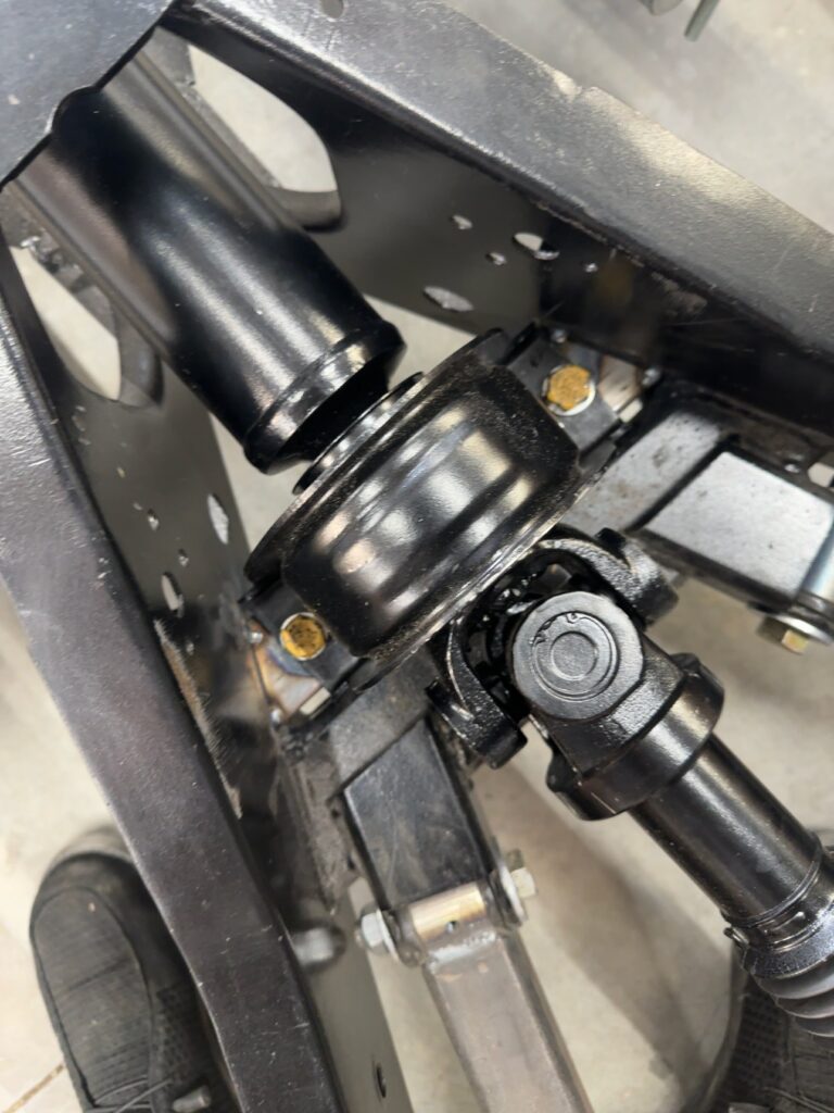 Close-up of Ole Nasty driveshaft carrier bearing and fabricated support